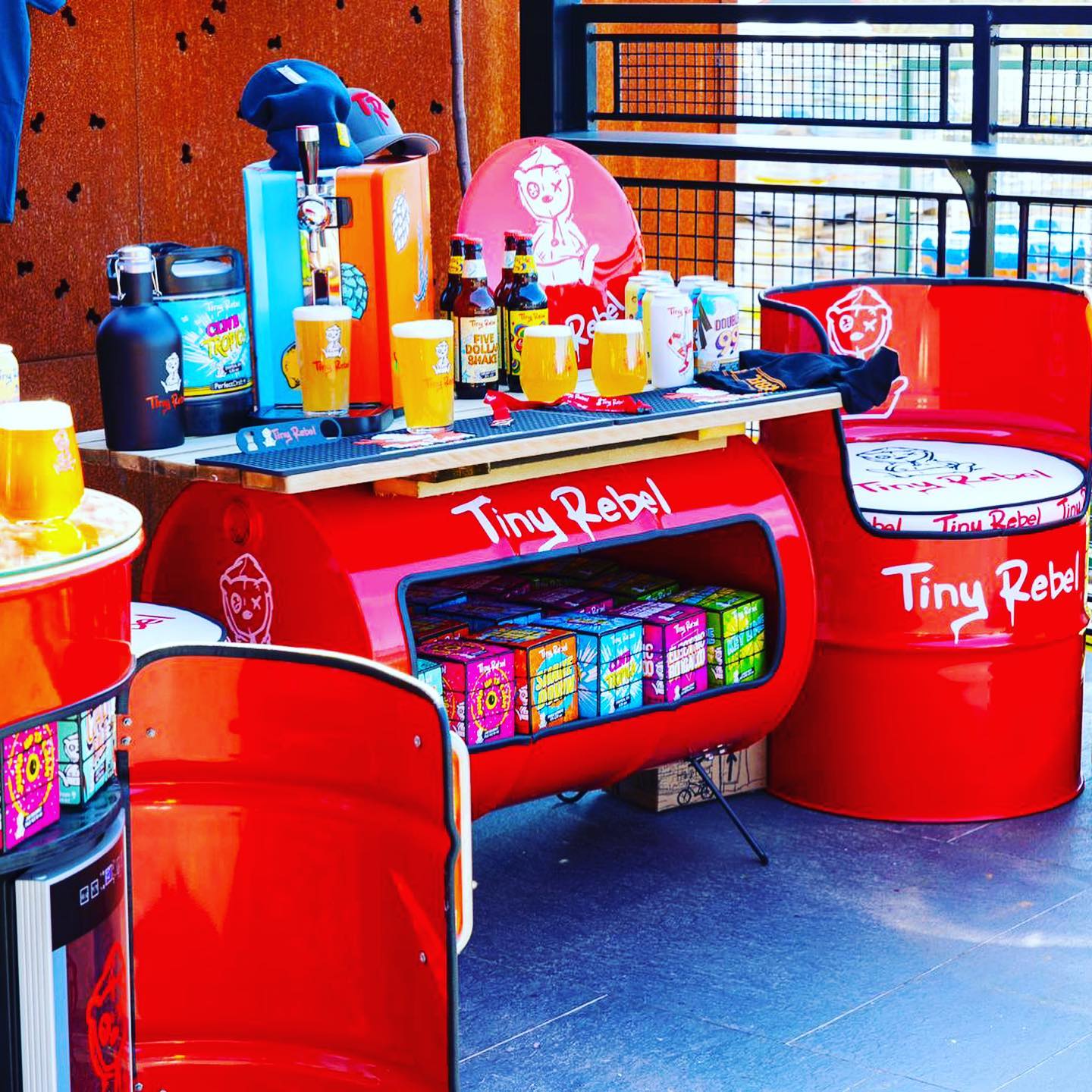 Red Tiny Rebel bar and seats made from upcycled 45 gallon drums